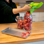 Tray Scoop Scooping Strawberries Into Jar